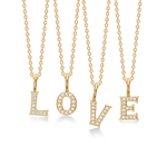 TENDER LOVE bogstaver i guld m. diamanter.